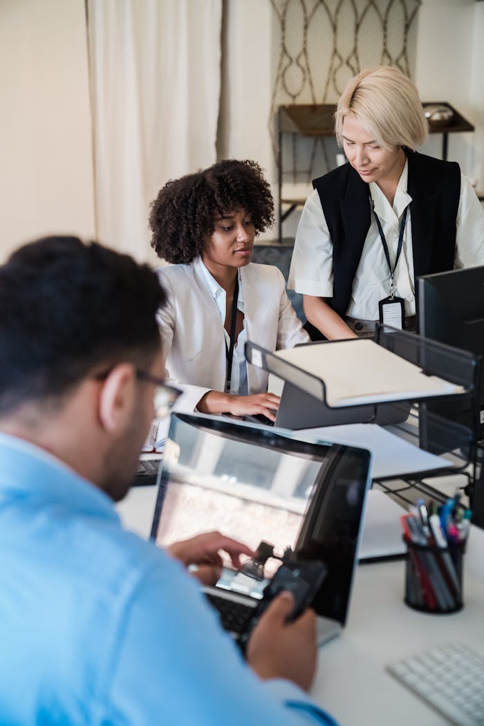services-10 A diverse group of professionals working together in a contemporary office setting, showcasing teamwork and collaboration.